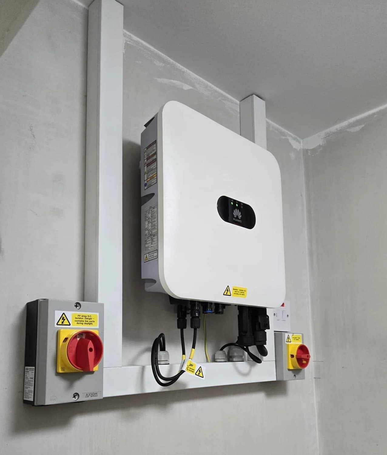 Wall-mounted inverter and electrical isolators from the supplied solar photo collection