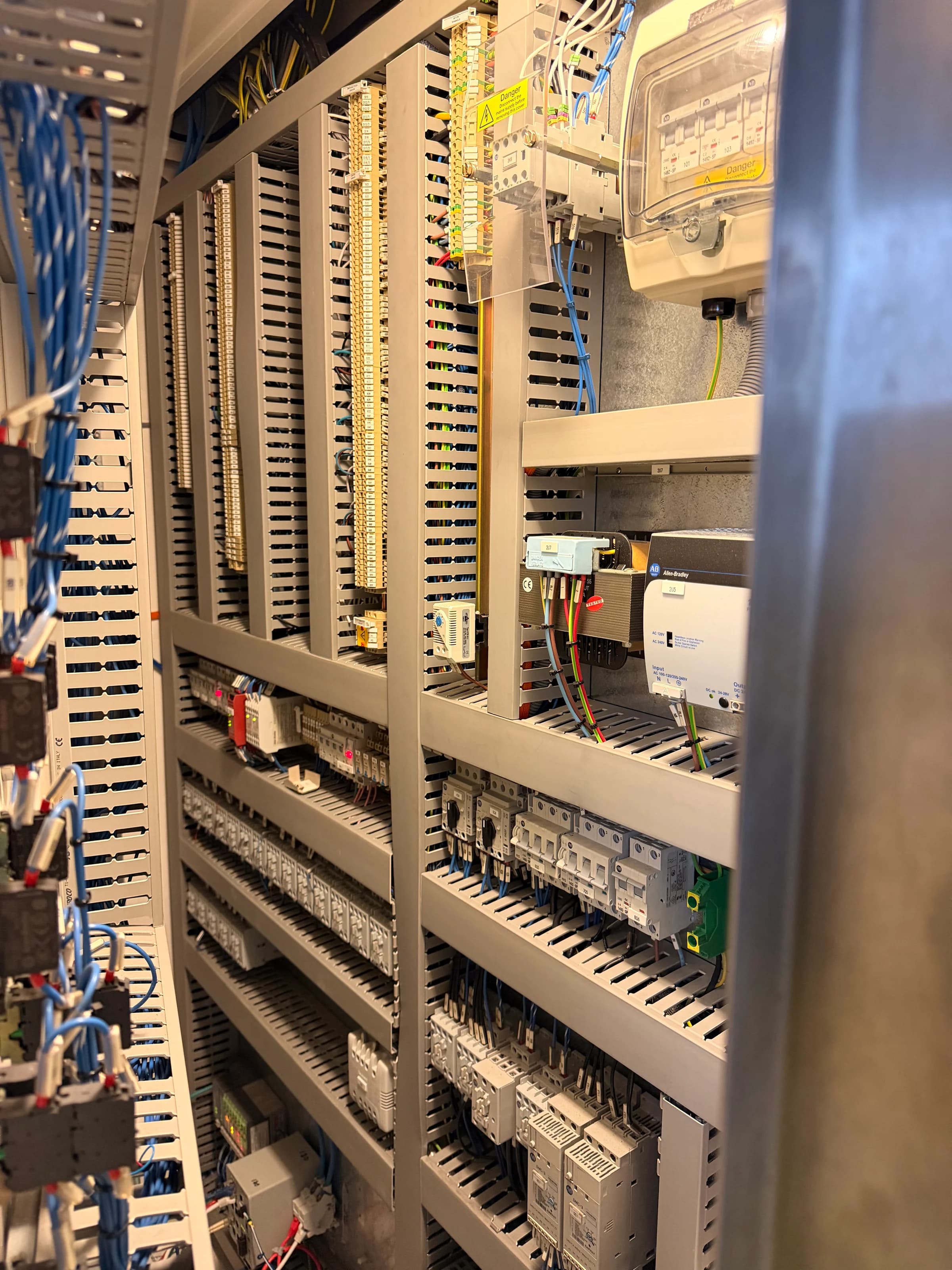 Industrial control cabinet showing organised terminals, cable routes and switching equipment